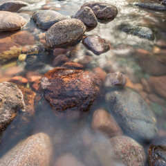 Rocks in a fast flowing crystal clear stream