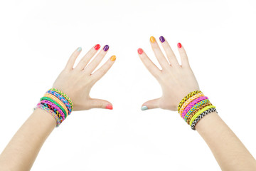 Loom bracelets on hands of young girl