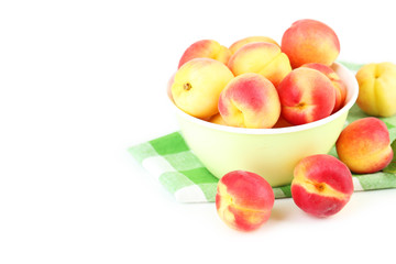 Fresh apricots in bowl on a white background