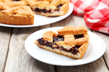 Homemade pie on grey wooden background