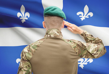 Soldier saluting to Canadial province flag conceptual series - Quebec
