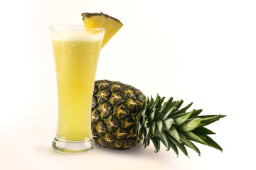 Glass of fresh juice with ripe pineapple and Pineapple friut