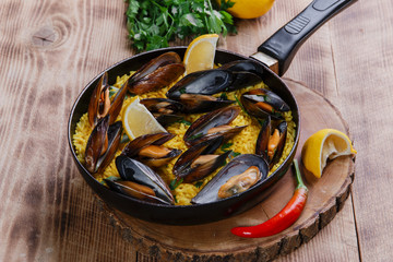 mussel paella rice in a frying pan
