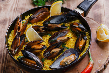 mussel paella rice in a frying pan