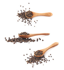 Wooden spoon and black peppercorn