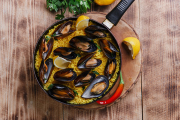mussel paella rice in a frying pan