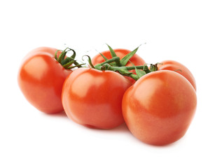Multiple red tomatoes on a single stem