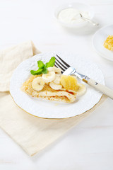 Delicious crepes with banana and honeycomb