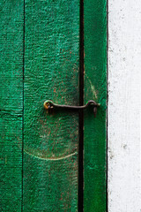 Metal hook in old wooden door