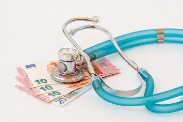 Expensive health treatment.  Stethoscope on money background