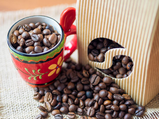 Pack of coffee and colorful cup on the table