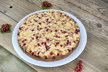 Currant cake on table