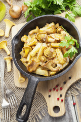 Fried potatoes with mushrooms