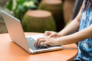 Fototapeta premium Woman hands typing on laptop