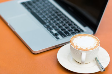 Woman hands typing on laptop