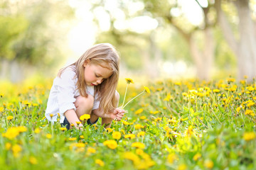 portrait of little girl outdoors in summer