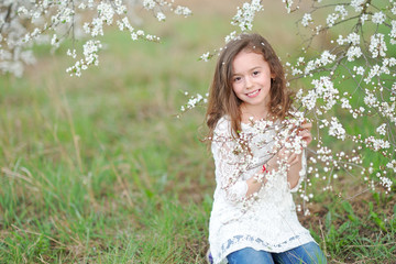 portrait of a beautiful little girl with flowers