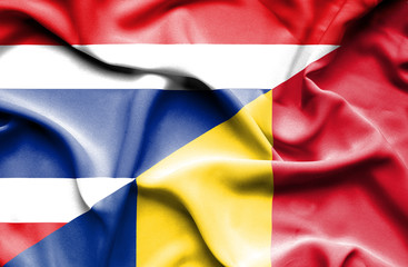 Waving flag of Romania and Thailand