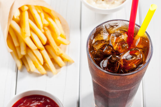 Cola with ice and french fries