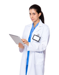 Fototapeta premium Woman doctor use of the digital tablet