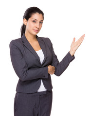 Young businesswoman showing open hand palm