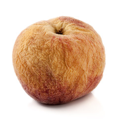 Old fruit on a white background