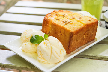 Honey toast with vanilla icecream on white square plate