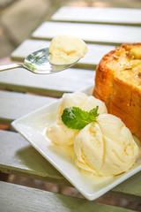 Honey toast with vanilla icecream on white square plate