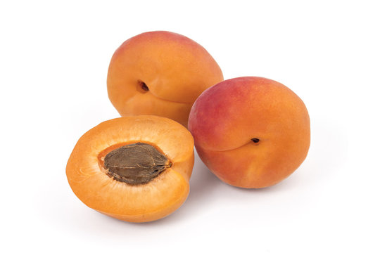 Fresh ripe organic apricots isolated on a white background