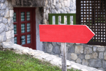 Red wooden signpost