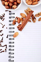 hazelnuts, almonds, walnuts with blank recipe book