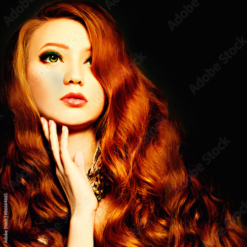 Beauty Woman with Makeup and Red Curly Hair. Fashion Background