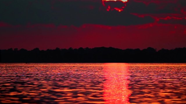 Sunset - dark red sun with mood and harmony