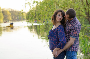Fototapeta premium family dad mother and daughter on a walk on nature