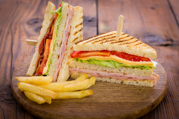 Club sandwiches on the wooden table