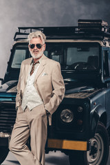 Stylish Matured Guy Leaning Against his Vehicle