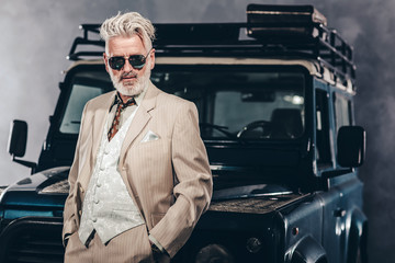 Stylish Matured Guy Leaning Against his Vehicle