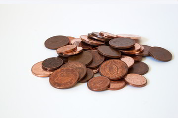 Some Euro coins displayed on a plain background.