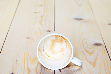 empty dirty cup of coffee lying on the boards