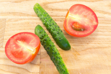 Cucumber and tomato with measuring