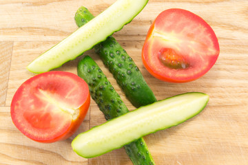 Cucumber and tomato with measuring