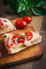 Sandwiches on a board on a wooden table