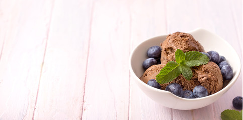 Chocolate ice cream with blueberries and mint