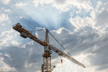 tall crane on cloudy sky