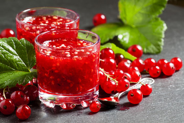 Fresh homemade jam rubbed red currants in a glass, selective foc