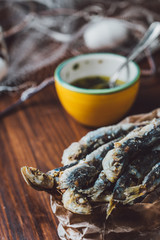 Fried sardines with parsley and olive oil