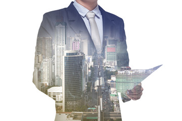 Double exposure of businessman and city