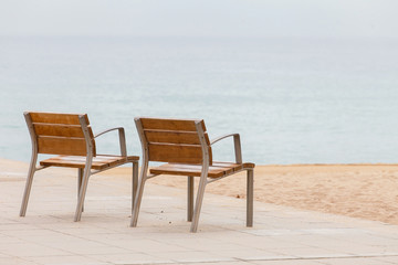 Fototapeta na wymiar empty chairs on the beach