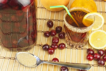Glasses with cherries with rum. Preparing for summer refreshment cocktail. Cane rum and sugar. Sour pickled in rum.
