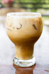 Iced coffee with milk is on the table.